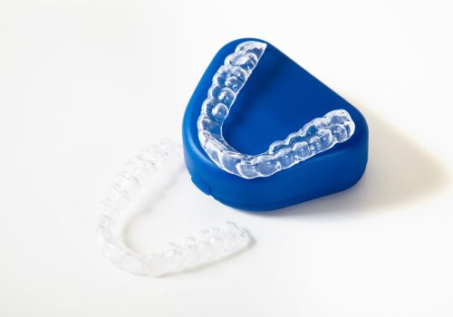 two dental whitening trays and a box for it